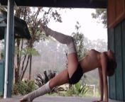 Naked yoga outdoors in Hawaii as the fog rolls in from hawaii